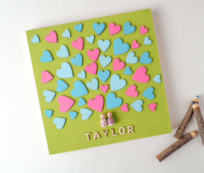 baby shower guestbook alternative - peg dolls. Baby Shower Wooden Guest book! Have your guests sign a heart and hang this guestbook in the baby or babies's room after the shower. Great keepsake and nursery décor! We hand-paint the baby peg dolls. Whether you are having a baby, twins, or triplets, we can customize.