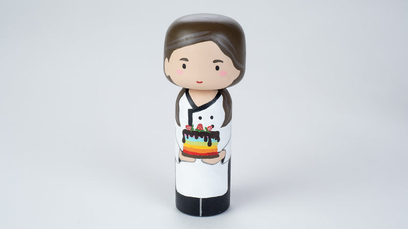 Baker - Hobby and occupational Kokeshi Doll.  Introducing our new hobby and occupational Kokeshi dolls!  Give something unique and personalized.  Customize a hobby or occupation of your family, friends, or colleagues on Kokeshi dolls!  They are hand-painted with love that show the uniqueness of each individual. 
