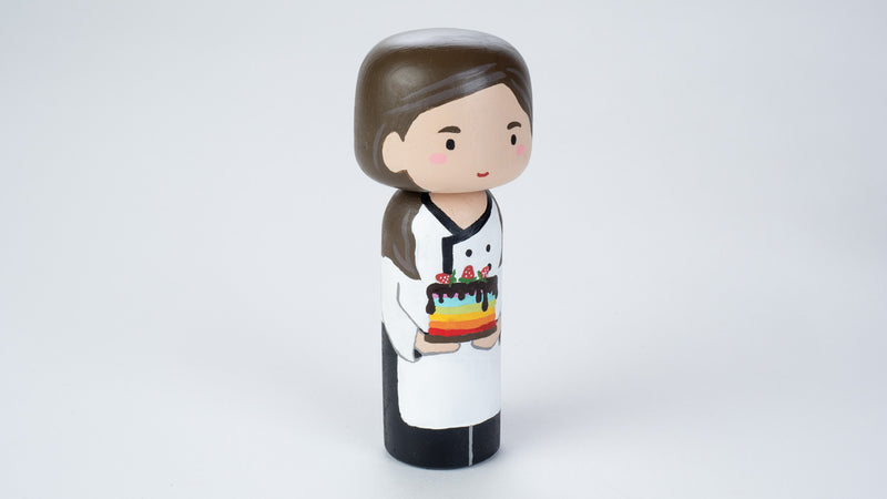 Baker - Hobby and occupational Kokeshi Doll.  Introducing our new hobby and occupational Kokeshi dolls!  Give something unique and personalized.  Customize a hobby or occupation of your family, friends, or colleagues on Kokeshi dolls!  They are hand-painted with love that show the uniqueness of each individual. 