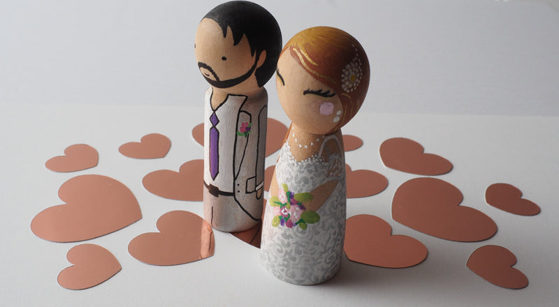 Customized wedding cake topper!  These cute peg dolls show the unique sides of you and your partner.  A great touch of personality to your wedding.  They will WOW your guests.  Also, what a great keepsake it would be!  These are also great for anniversary gifts, couples’ gifts, bridal showers, or any other occasions.