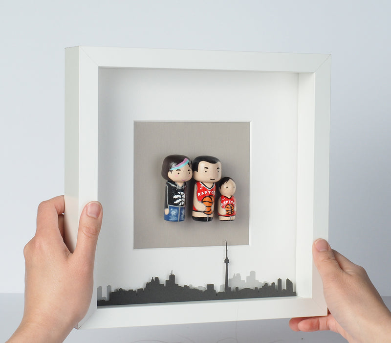 Give something unique and personalized. Custom peg dolls of your family! They are hand-painted that show the uniqueness of each individual in your family. A white shadow frame is included with the city landscape of your hometown! This will definitely touch the heart and bring smiles, may be even happy tears of your loved ones.  These are great for parents, grandparent’s gifts, birthdays, anniversary gifts, couples’ gifts, or any other occasions.