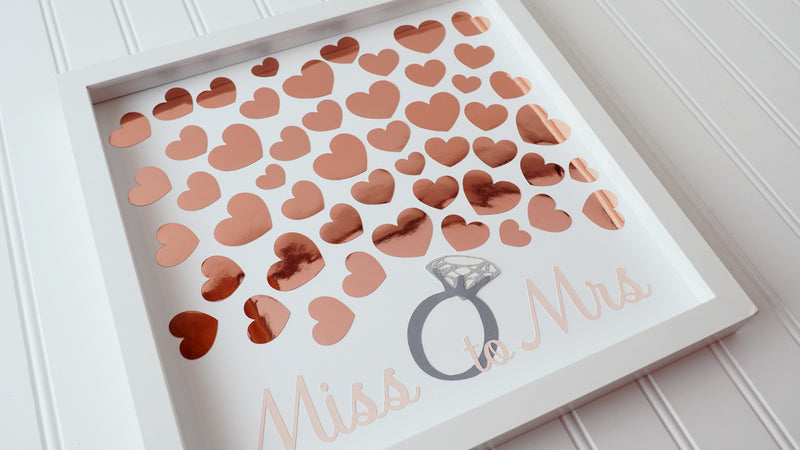 Throwing a bridal shower?  Have your guests sign a rose gold heart and preserve the beautiful memories for many years to come.  This 12"x12" Bridal shower guest book alternative consist of up to 50 hearts.  Other sizes are also available. 