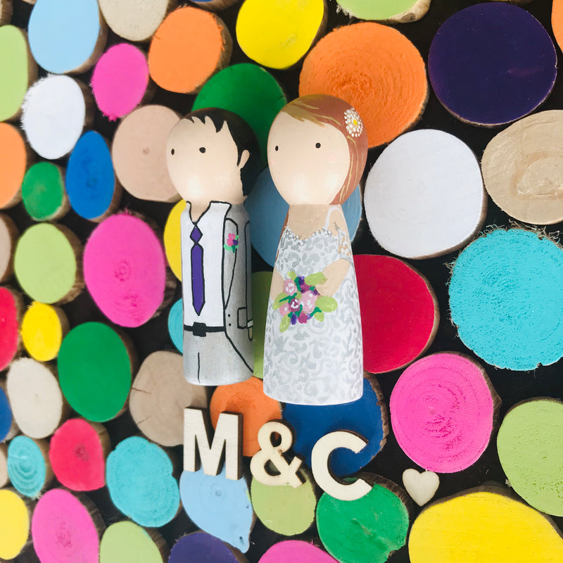 Wooden Wedding guestbook alternative and custom wedding couple on wooden peg dolls! Why pick only a few colours for your wedding theme when you can have the whole world of colours!  Customize your portraits on tiny peg dolls and have your guests sign a wooden disc.  Hang this framed guestbook after the wedding to preserve beautiful memories of the special day for many years to come.