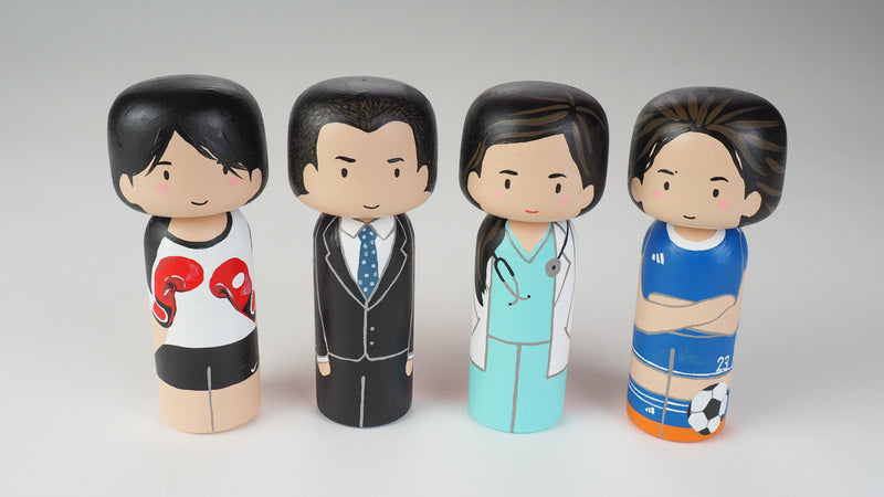 Introducing our new family portrait Kokeshi dolls!  Give something unique and personalized.  Customize your family, friends, or colleagues on Kokeshi dolls!  They are hand-painted with love that show the uniqueness of each individual such as specific sports or hobby.  Here is a family member who loves soccer but we can customize any sports. 